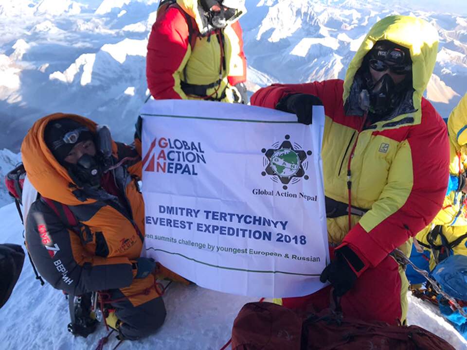 Photo-1---Dmitry-on-the-summit-of-Everest-with-the-GAN-flag.jpg